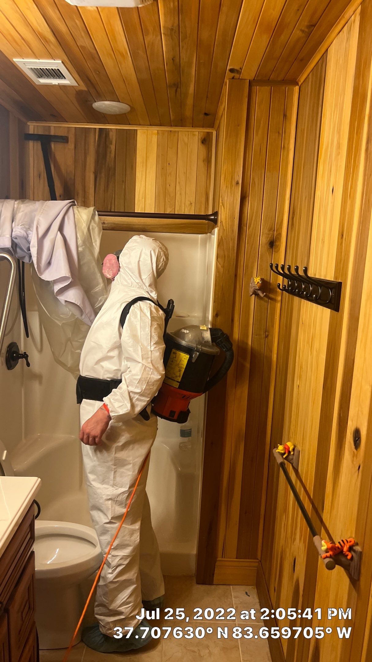 a man in a white suit and protective gear