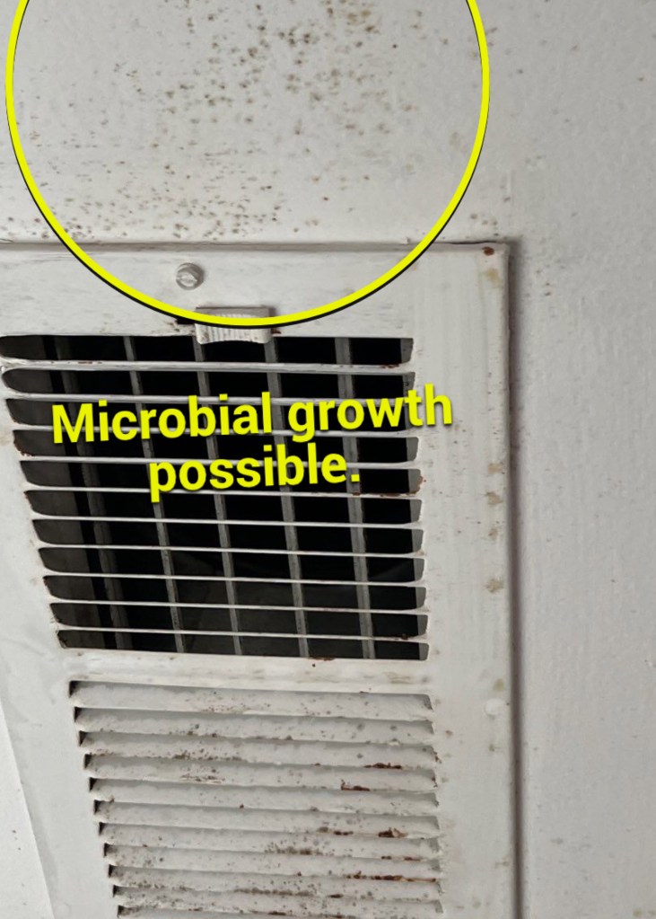 a white air conditioner with the words microbial growth possible