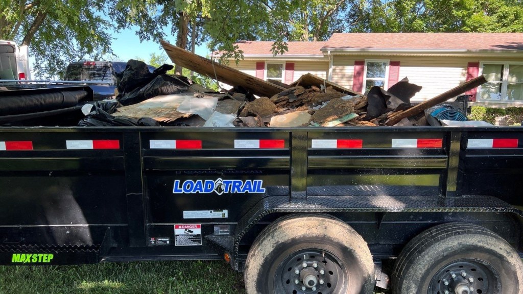 a dump truck is parked in front of a house